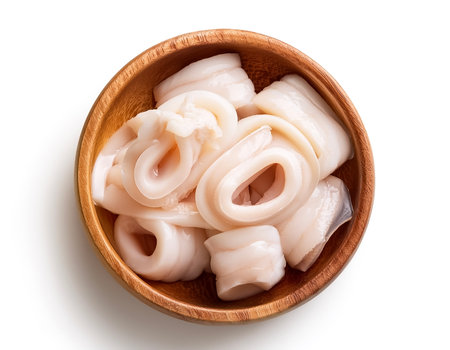 squid meat in wooden bowl isolated on white backgroundの写真素材