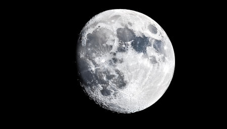 Closeup shot of the moon isolated on a black backgroundの写真素材