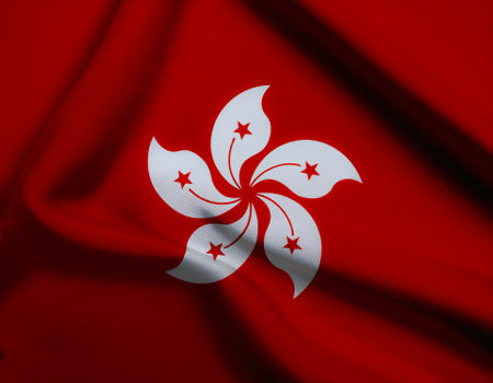 Hong Kong flag waving in the wind. Close up of Hong Kong banner blowing, soft and smooth silk. Cloth fabric texture ensign background. Use it for national day and country occasions conceptの写真素材