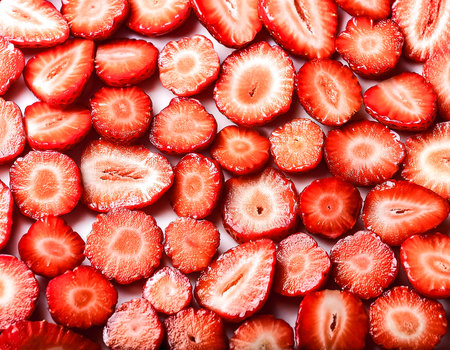 Fresh sweet strawberry slices pattern backgrond, close upの写真素材