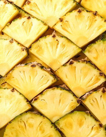 Fresh sweet pineapple slices pattern backgrond, close upの写真素材