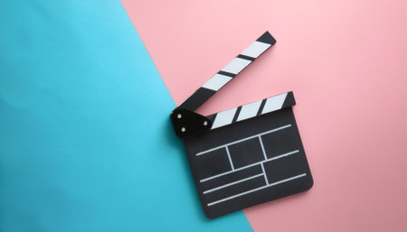 Movie gripper. Movie clipboard, isolated on a Soft blue and Pink Pastelの写真素材