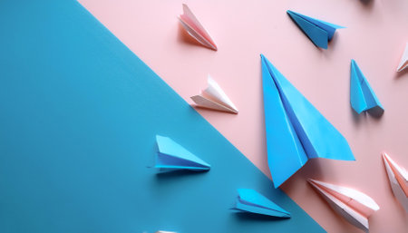 blue paper planes, isolated on a soft blue and Pink Pastelの写真素材