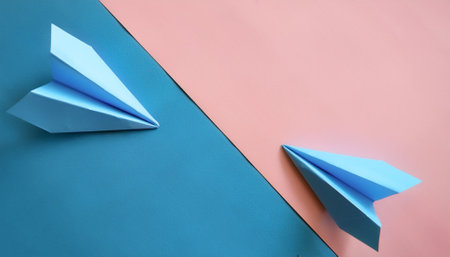 blue paper planes, isolated on a soft blue and Pink Pastelの写真素材