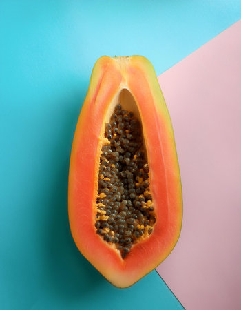 papaya fruit isolated on a soft blue and Pink Pastelの写真素材
