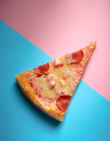 pizza slice, isolated on a soft blue and Pink Pastelの写真素材