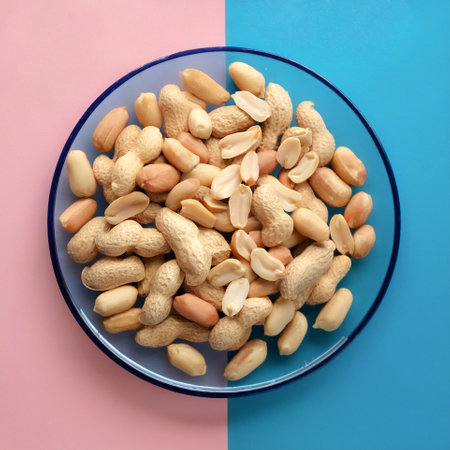 peanuts slices, isolated on a soft blue and Pink Pastelの写真素材