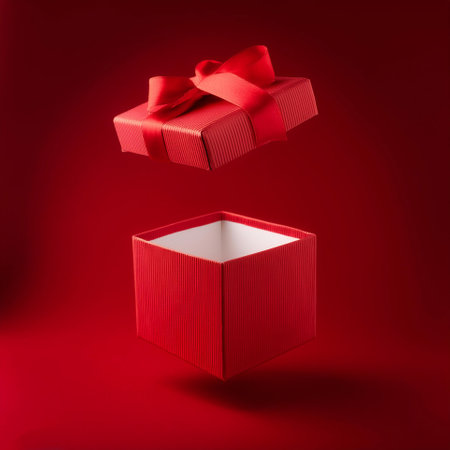 Red kraft paper gift box with red ribbonの写真素材