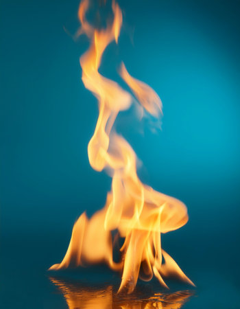 Fire flames floating or flying isolated on light blue backgroundの写真素材
