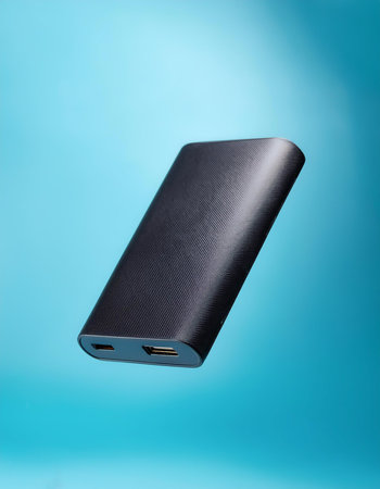 Powerbank floating or flying isolated on light blue backgroundの写真素材