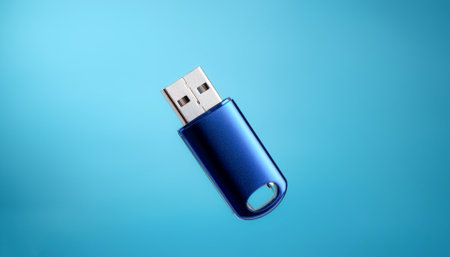 Mini Flash drive floating or flying isolated on light blue backgroundの写真素材