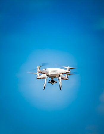 Drones floating or flying isolated on light blue backgroundの写真素材