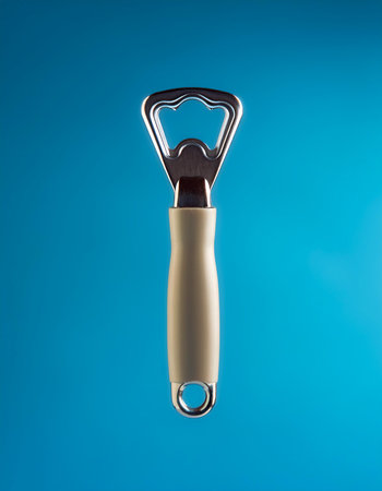 Bottle opener floating or flying isolated on light blue backgroundの写真素材