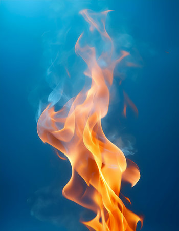 Fire flames floating or flying isolated on light blue backgroundの写真素材