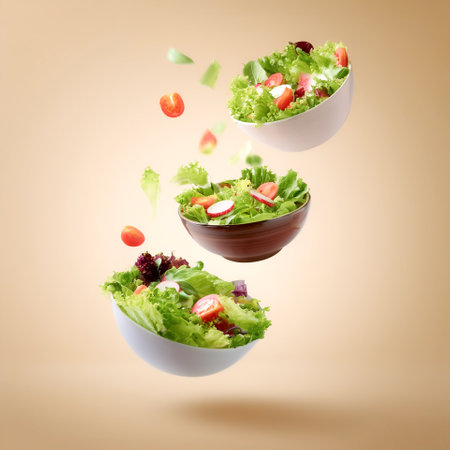 Salad bowls floating or flying isolated on biege backgroundの写真素材