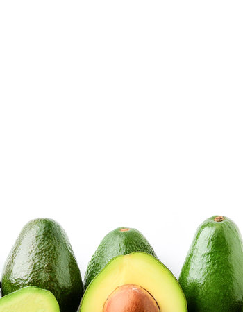 Avocado fruit border isolated on white background with copy spaceの写真素材