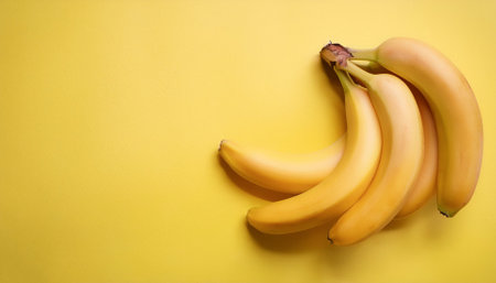 Banana fruits, isolated on a pastel yellowの写真素材