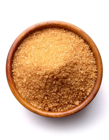 brown sugarÂ in wooden bowl isolated on white backgroundの写真素材