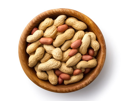 peanuts in wooden bowl isolated on white backgroundの写真素材