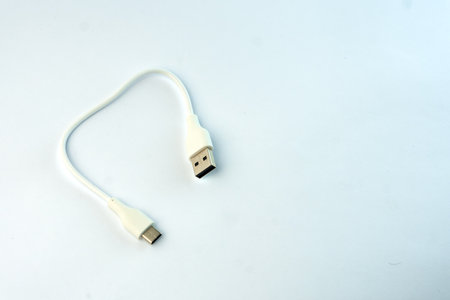 White USB to Micro USB cable for fast charging and data transfer. Compact and durable, ideal for...