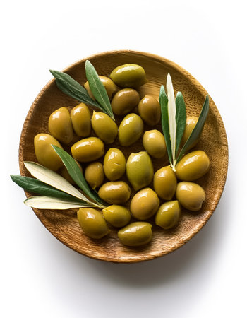 olives with olive leaves, isolated on a clean white backgroundの写真素材