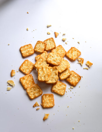 Crushed dry crackers, isolated on a clean white backgroundの写真素材