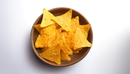 delicious mexican nachos chips, isolated on a clean white backgroundの写真素材