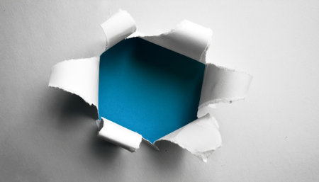 Ragged hole torn in ripped paperの写真素材