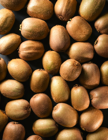 Focus on the pile of fresh Kiwiの写真素材