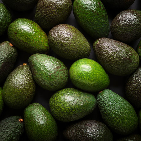 Avocado. Creative background design with food theme, focus on the pile of fresh Avocadoの写真素材