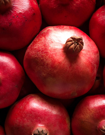 Pomegranate. Creative background design with food theme, focus on the pile of fresh Pomegranateの写真素材