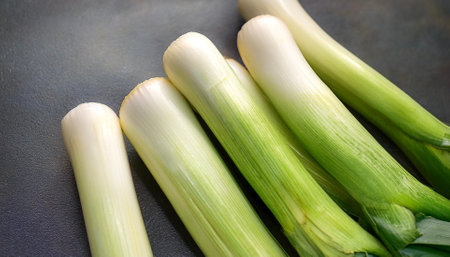 Leek Vegetables, Creative background design with food theme, focus on the pile of fresh Leekの写真素材