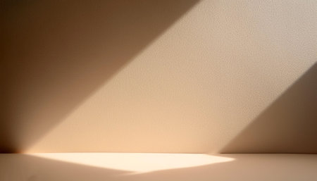 Empty biege background for product presentation with beautiful lights and shadowsの写真素材