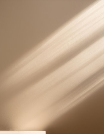 Empty biege background for product presentation with beautiful lights and shadows