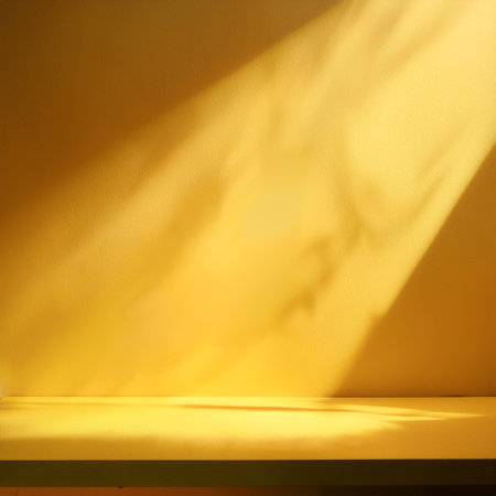 Empty yellow background for product presentation with beautiful lights and shadowsの写真素材