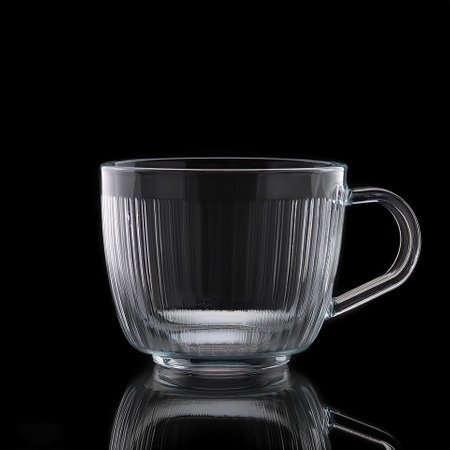 clear glass cup, isolated on a dark blackの写真素材