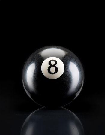 number 8 eight ball, the black ball, isolated on a dark black
