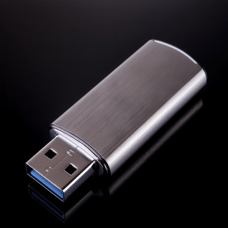USB Flash drive, isolated on a dark blackの写真素材