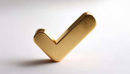 A shiny gold tick mark, often symbolizing confirmation or correct choice on side position provides copy space for text. background concept isolated whiteの写真素材