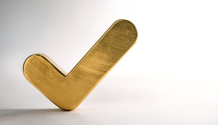 A shiny gold tick mark, often symbolizing confirmation or correct choice on side position provides copy space for text. background concept isolated whiteの写真素材