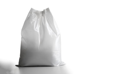 A white plastic bag with a white label on side position provides copy space for text. background...