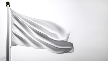 Plain white flag waving on a pole on side position provides copy space for text. background concept isolated whiteの写真素材