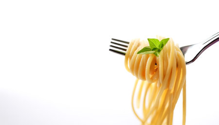 Spaghetti on a fork on side position provides copy space for text. background concept isolated whiteの写真素材