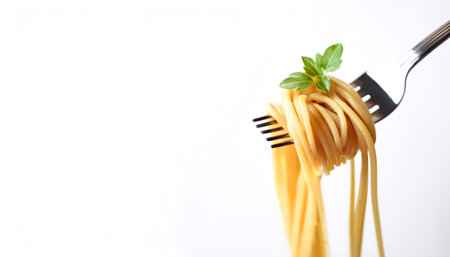 Spaghetti on a fork on side position provides copy space for text. background concept isolated whiteの写真素材