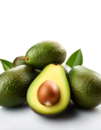 avocado whole and sliced scattered around background concept isolated whiteの写真素材