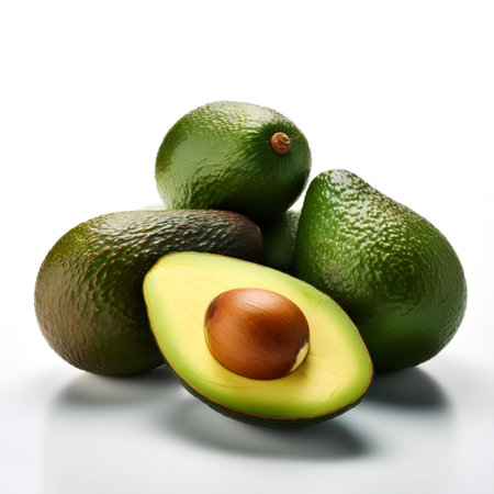 avocado whole and sliced scattered around background concept isolated white