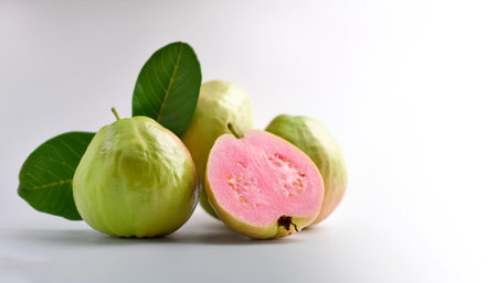 guava fruit on side position provides copy space for text. background concept isolated whiteの写真素材