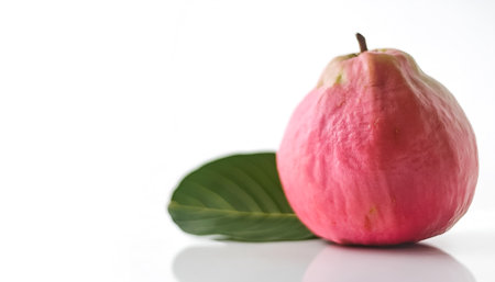 guava fruit on side position provides copy space for text. background concept isolated whiteの写真素材