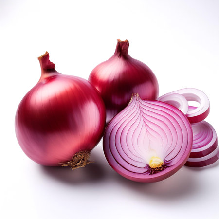 red onion whole and slices scattered around background concept isolated whiteの写真素材