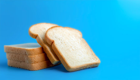 Delicious bread slices on side position provides copy space for text. background concept isolated light blue backgroundの写真素材